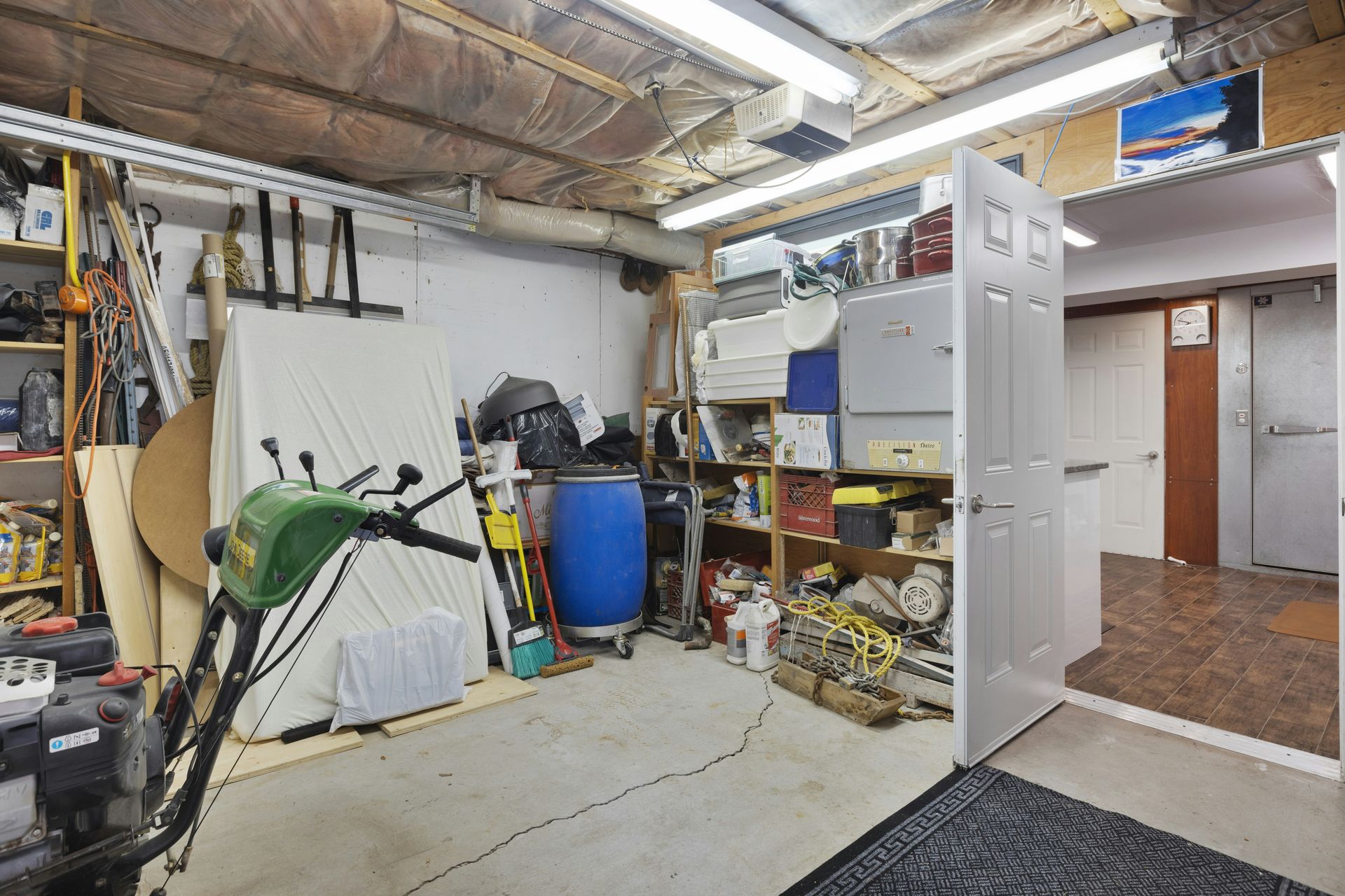 a garage filled with lots of clutter and tools